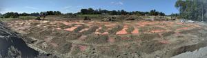 View of the impacted soil pile with the orange marker layer.